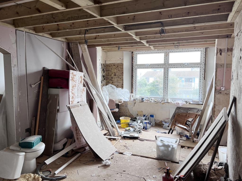 Lot: 3 - SIX-BEDROOM GUEST HOUSE FOR INVESTMENT - Unfinished project with builders materials bare walls and floors